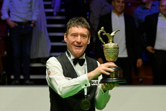 Jimmy White lifts the World Seniors Snooker Championship trophy.