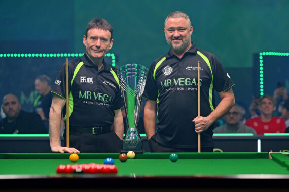 Jimmy White and Stephen Hendry pose before the final by the baulk end of the table with the trophy in front and in between them.
